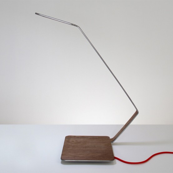 minimalist table lamp with a wooden base and a metal part