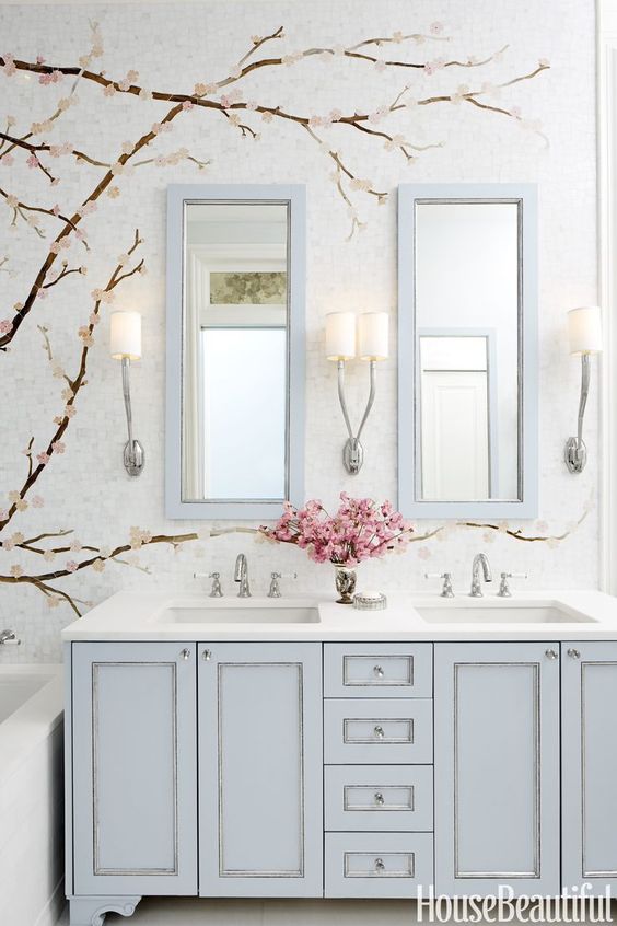 powder blue double vanity and matching mirror frames for a girlish bathroom