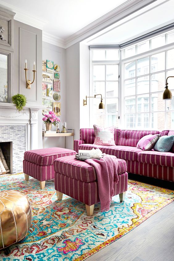 striped bold pink sofa and matching stools or ottomans for a boho-inspired room