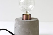10 a table lamp with a concrete base and a bulb looks simple and laconic