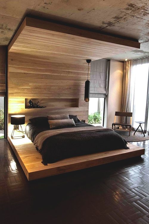 Minimalist light colored wooden bed with a roof and a platform ples a built in shelf