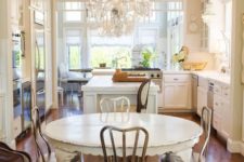12 a rustic shabby chic kitchen with a sheer crystal chandelier on a white chain