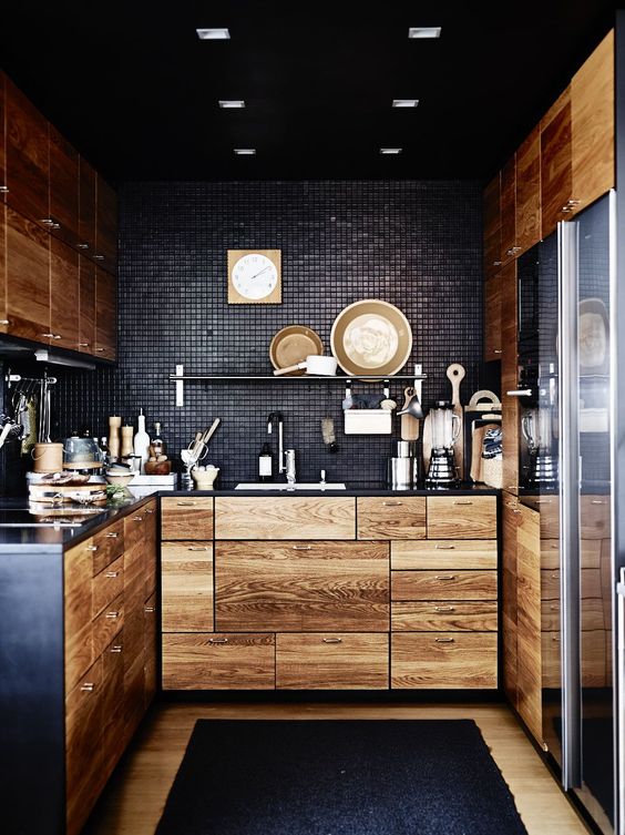 black tiles look stunning with light-colored wooden cabinets