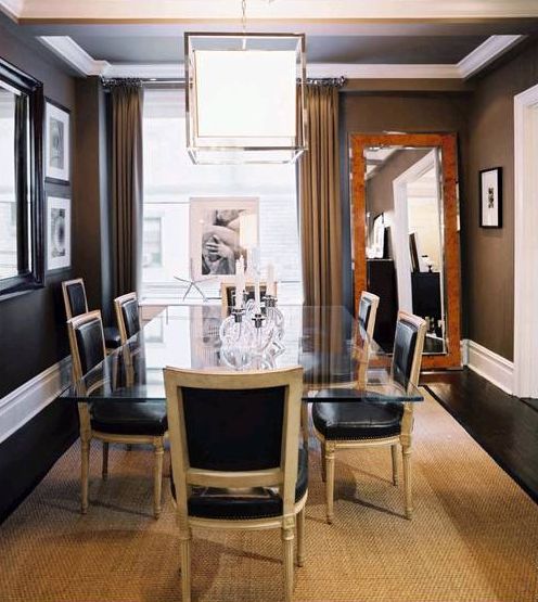 elegant black leather and light wood chairs look gorgeous with a glass top table
