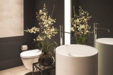 12 gorgeous round free-standing sink in a black bathroom