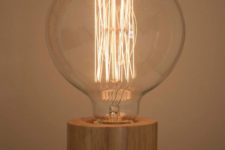 12 modern table lamp made of a wooden base and a large bulb looks very natural