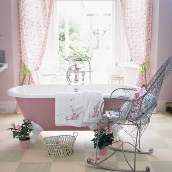 a rustic bathroom with a light pink bathtub