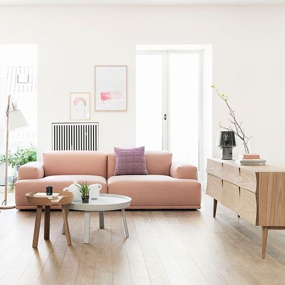 soft modern pink sofa with no legs bleds this Scandinavian room perfectly
