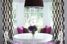 14 white chairs with purple upholstery and echoing pillows