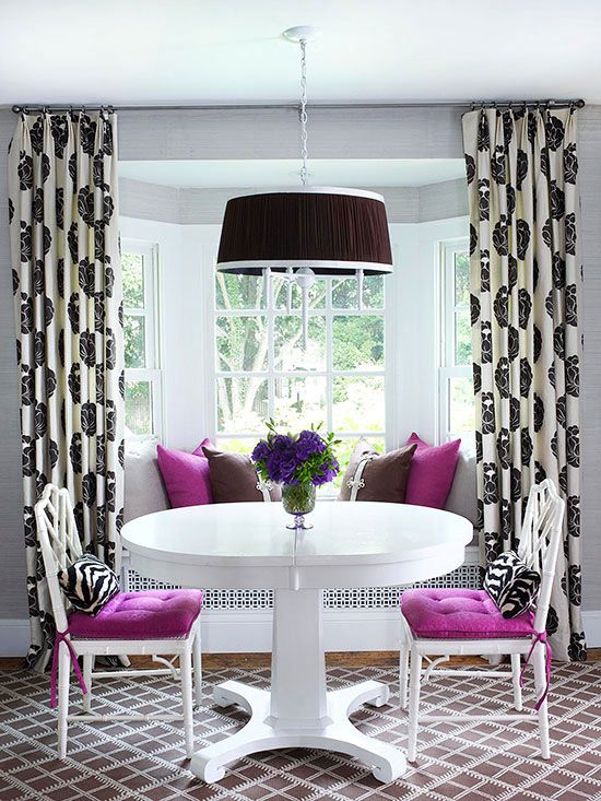 white chairs with purple upholstery and echoing pillows