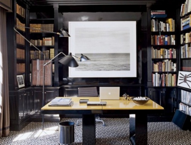 bookshelves all around create a library feel, which is elegant and cozy