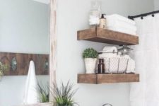 15 modern farmhouse bathroom with thick floating reclaimed wood shelves