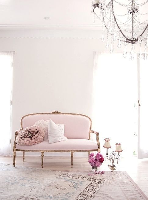 vintage light pink sofa on gilded legs and with an oval-shaped back