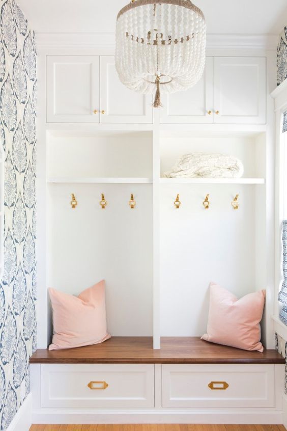 a cute white bead chandelier adds chic to this hallway