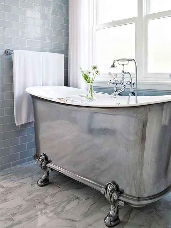 A stunning metallic claw foot tub with a vintage feel