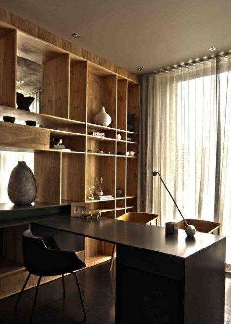these light wood shelves contrast with a black desk and create a bold display feature