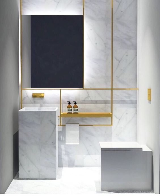 white marble and brass look edgy and stylish together, and simple shapes highlight the materials