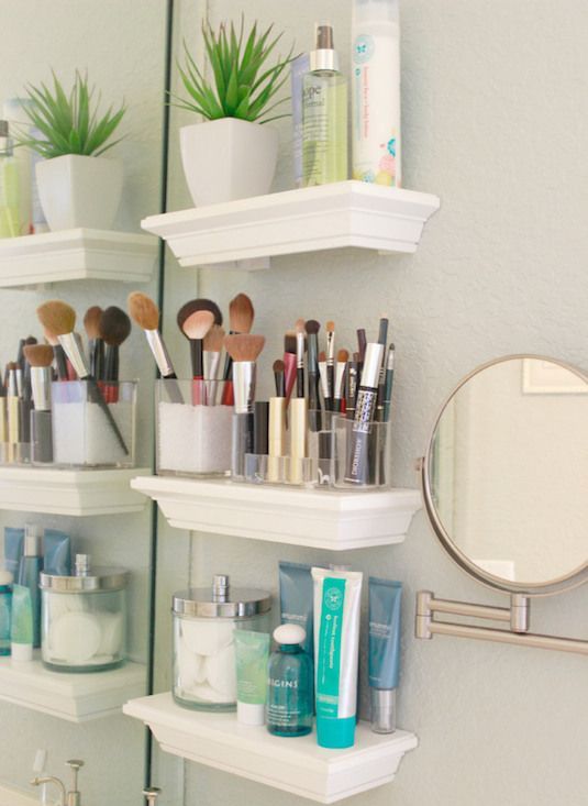 small floating shelves next to the bathroom mirror for storing all your makeup