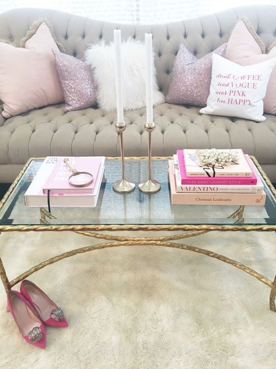 a gilded leg and frame table with a glass top is the most glam idea possible