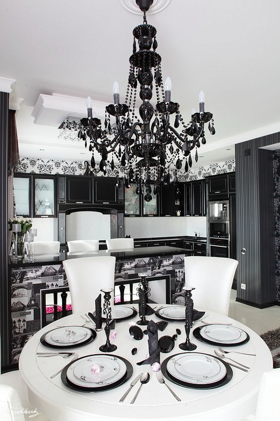 a modern black glam chandelier with black crystals is a fresh take on a traditional vintage one