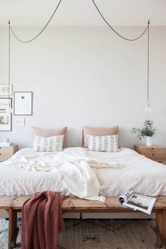 bulbs hanging on each side of the bed look modern and simple