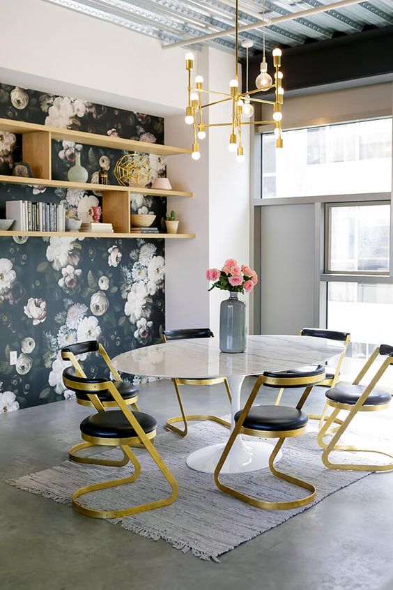 gold and black chairs look glam and echo with a gold chandelier