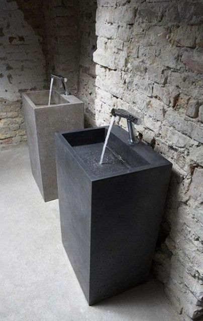 concrete square sinks with nickel faucets look laconic and manly