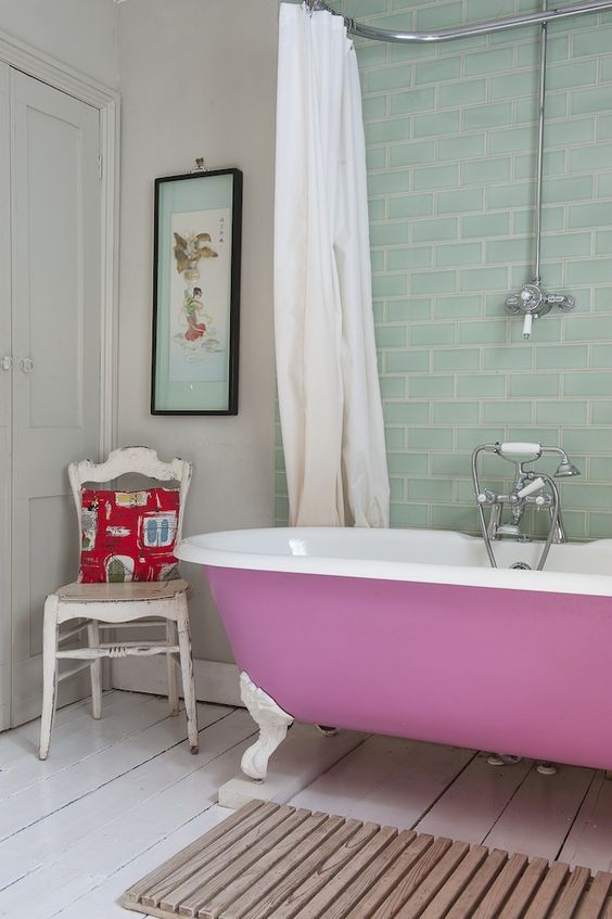 painted pink tub on white legs for a cute feminine bathroom