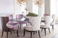 21 upholstered lavender chairs and gold butterfly chandeliers make the space girlish