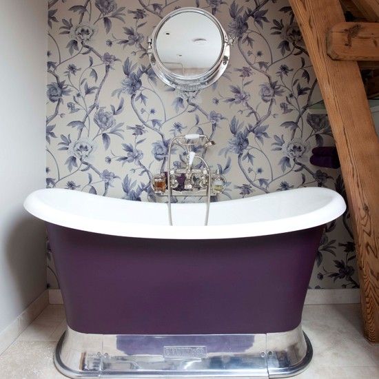 a small purple girlish tub on a polished metal stand