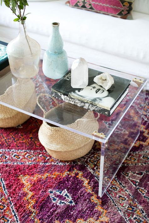 lucite coffee table with brass elements for a chic modern look