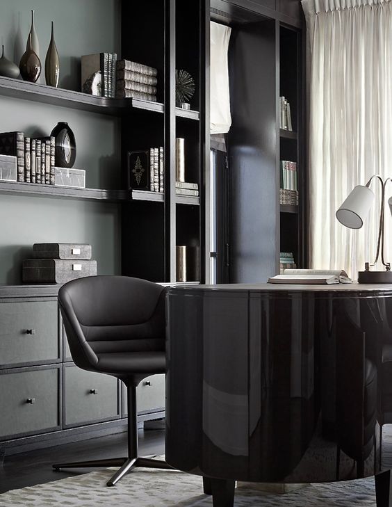 moody office design with open shelving and some drawers for a neat look