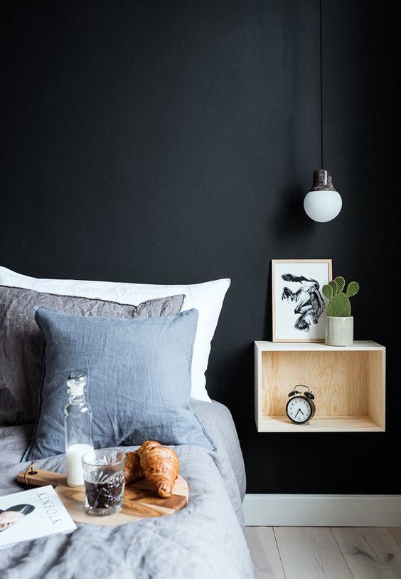 an industrial metal covered bulb  completes the bedroom decor