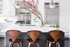23 dark grey kitchen island with a white top and warm-colored chairs