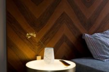 23 lit up bedside table that is fastened to the wall or headboard