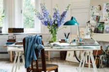 24 a metal blue lamp is a colorful touch in this neutral office