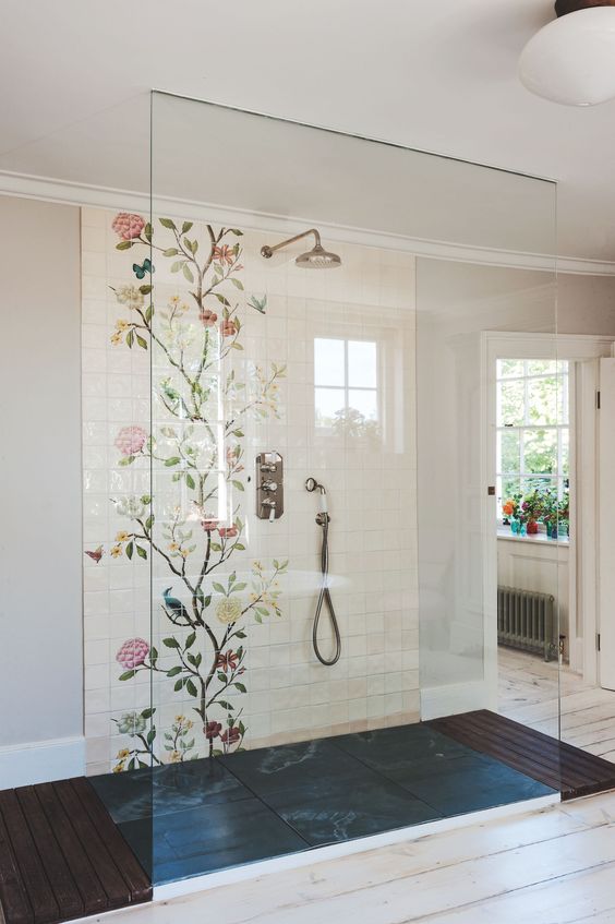 A walk in shower with floral tiles looks girlish