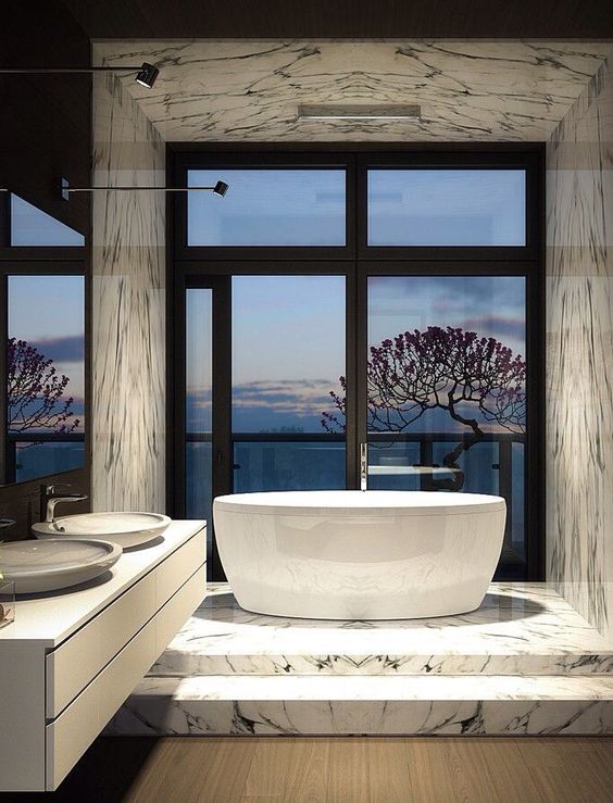 luxury bathroom with marble tiles and a gorgeous view from the tub
