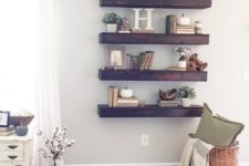 24 thick dark stained wood shelves make a statement in a light-colored space