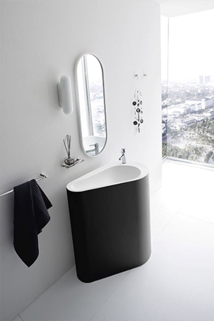 a monolith black and white bathroom sink looks fresh and unusual yet timeless