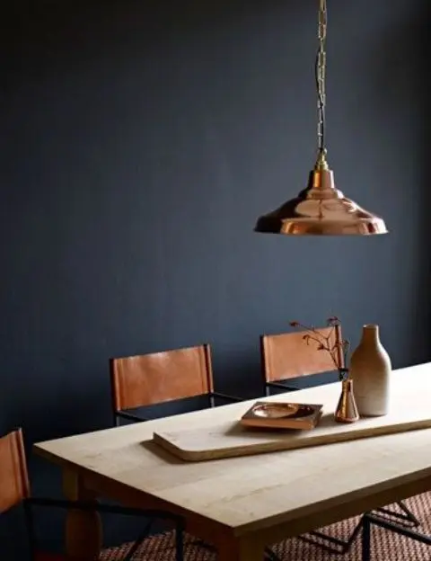 copper pendant lamp and leather chairs in the same shade