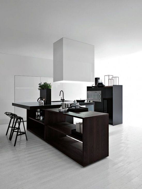 dark stained wooden kitchen island in a black and white kitchen