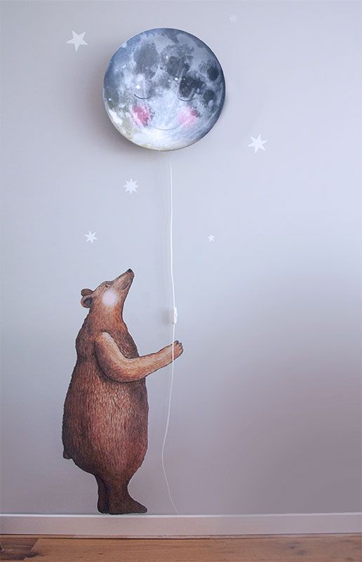 a dreamy sleepy moon wall lamp with a bear sticker for a whimsy look
