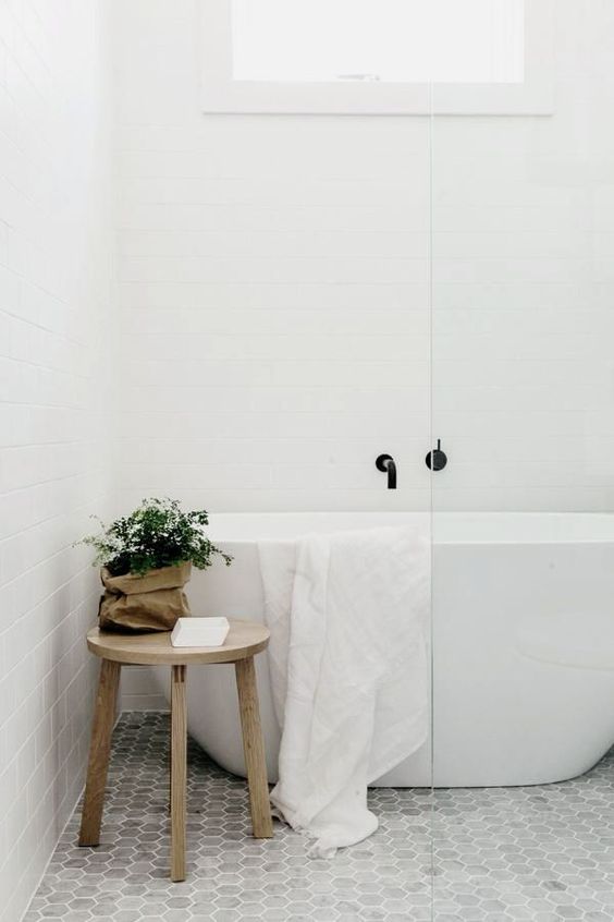 small home spa with marble hexagon tiles and a tub in the shower zone