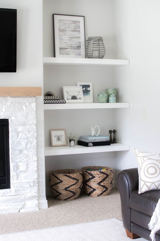 white floating shelves in a niche are a great idea for a modern living room