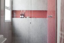 27 a concrete shower with coral tile inserts looks feminine yet very modern