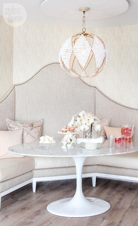 a gorgeous crystal and gold chandelier completes this refined space