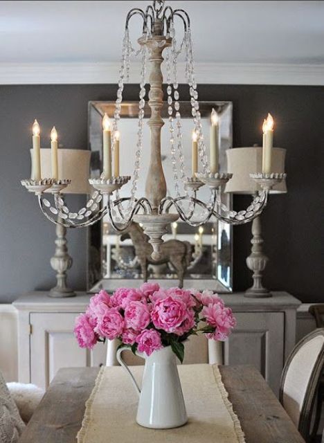 a refined vintage chandelier with crystals and faux candles