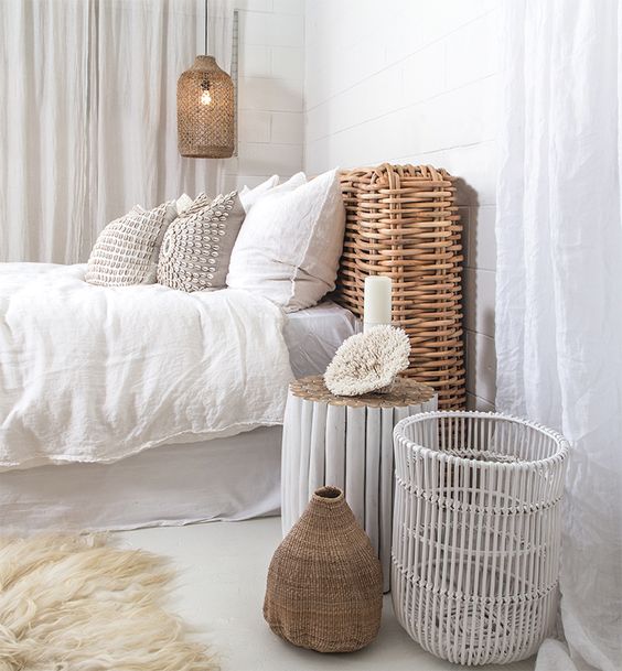a wicker pendant lamp echoes with the same headboard and accessories