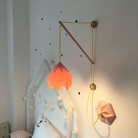 an orange geometic wall lamp for a girl's space
